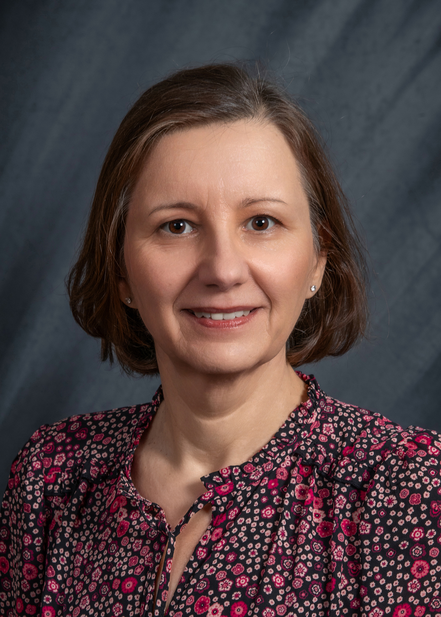 a portrait of Dr. Dorota Kopycka-Kedzierawski.