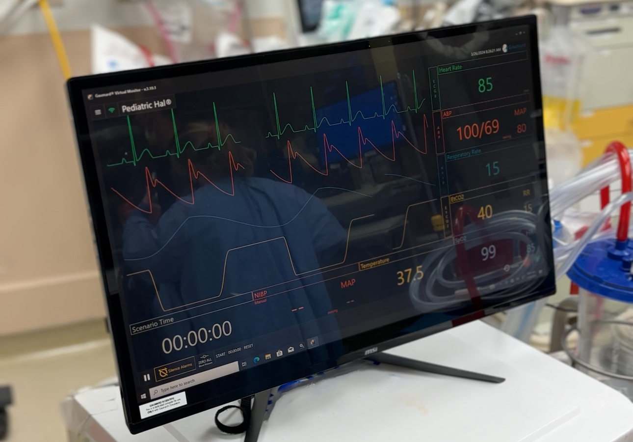 Computer shows mock vital signs of simulation patient for trauma center training.