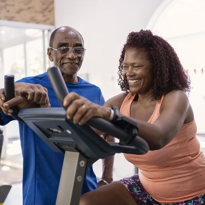 couple exercising on treadmill
