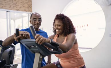 couple exercising on treadmill