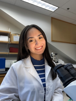 a girl with long hair in a lab coat