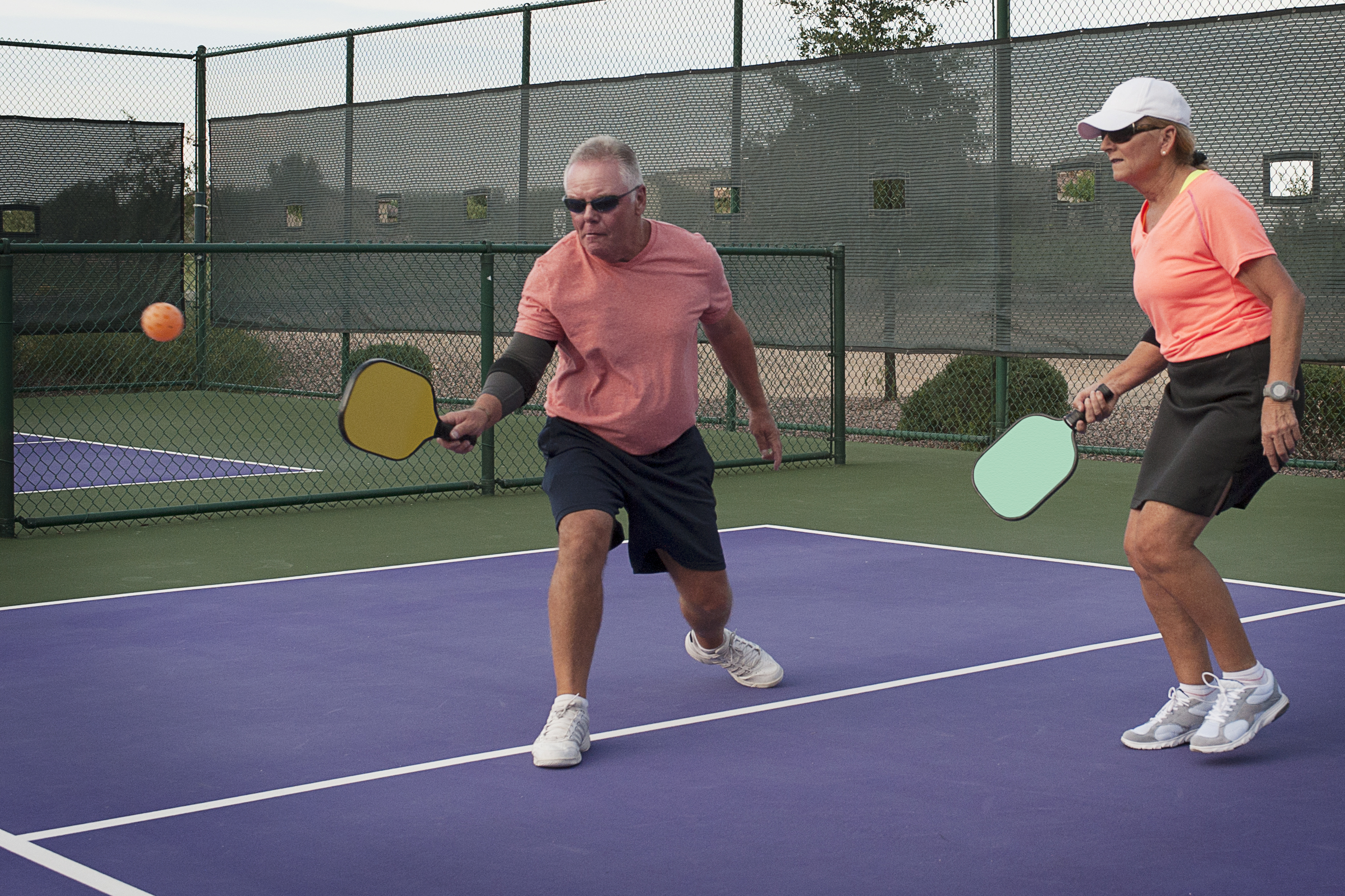 pickleball older couple action shot