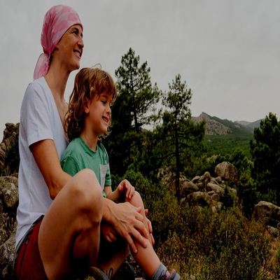 Woman with cancer enjoying nature with her son