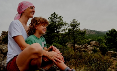 Woman with cancer enjoying nature with her son