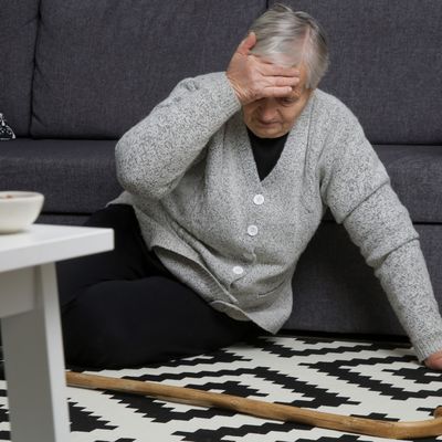 falls prevention woman on floor with cane