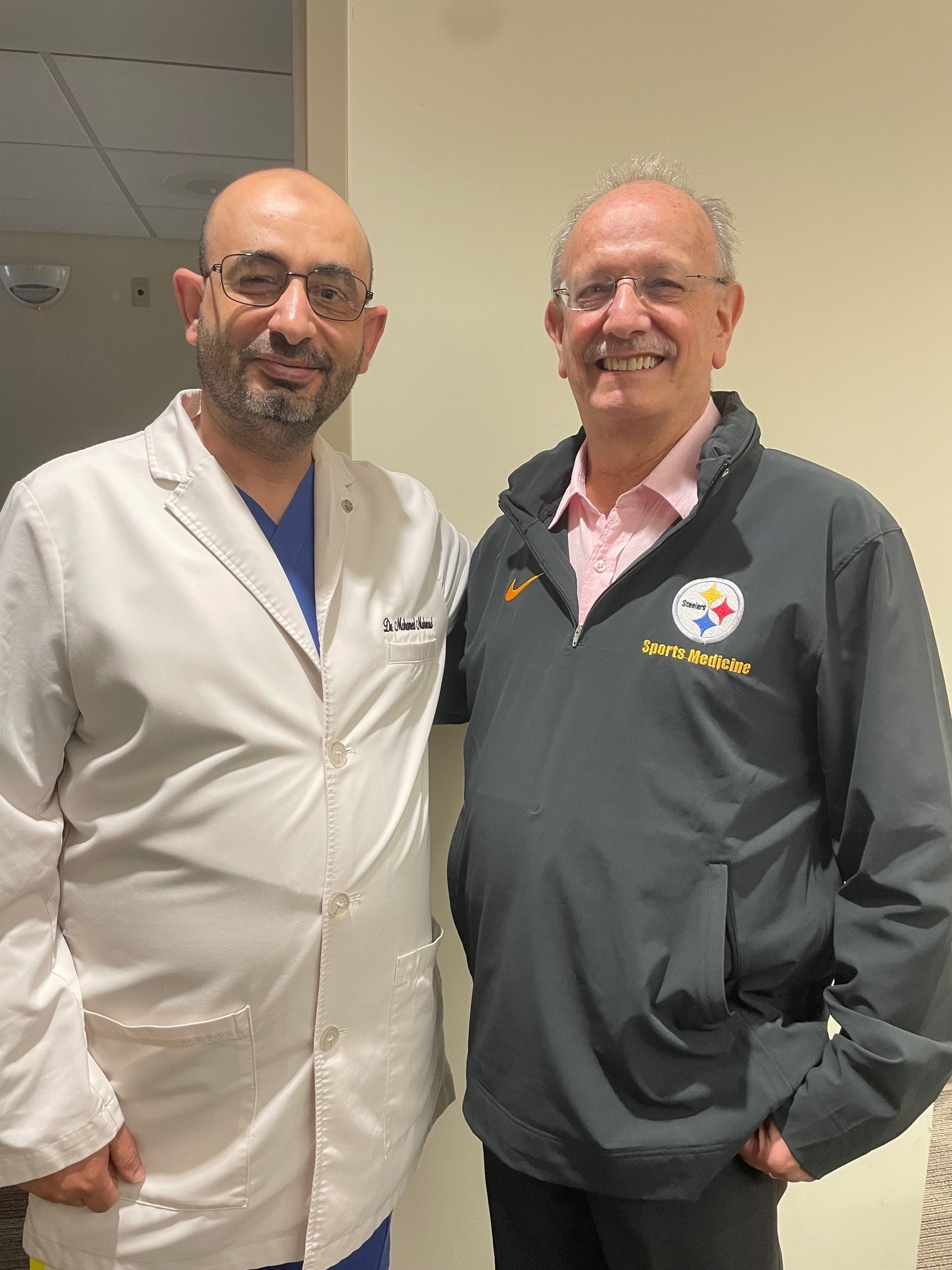 Drs Gottlieb and Mahmoud standing looking at camera