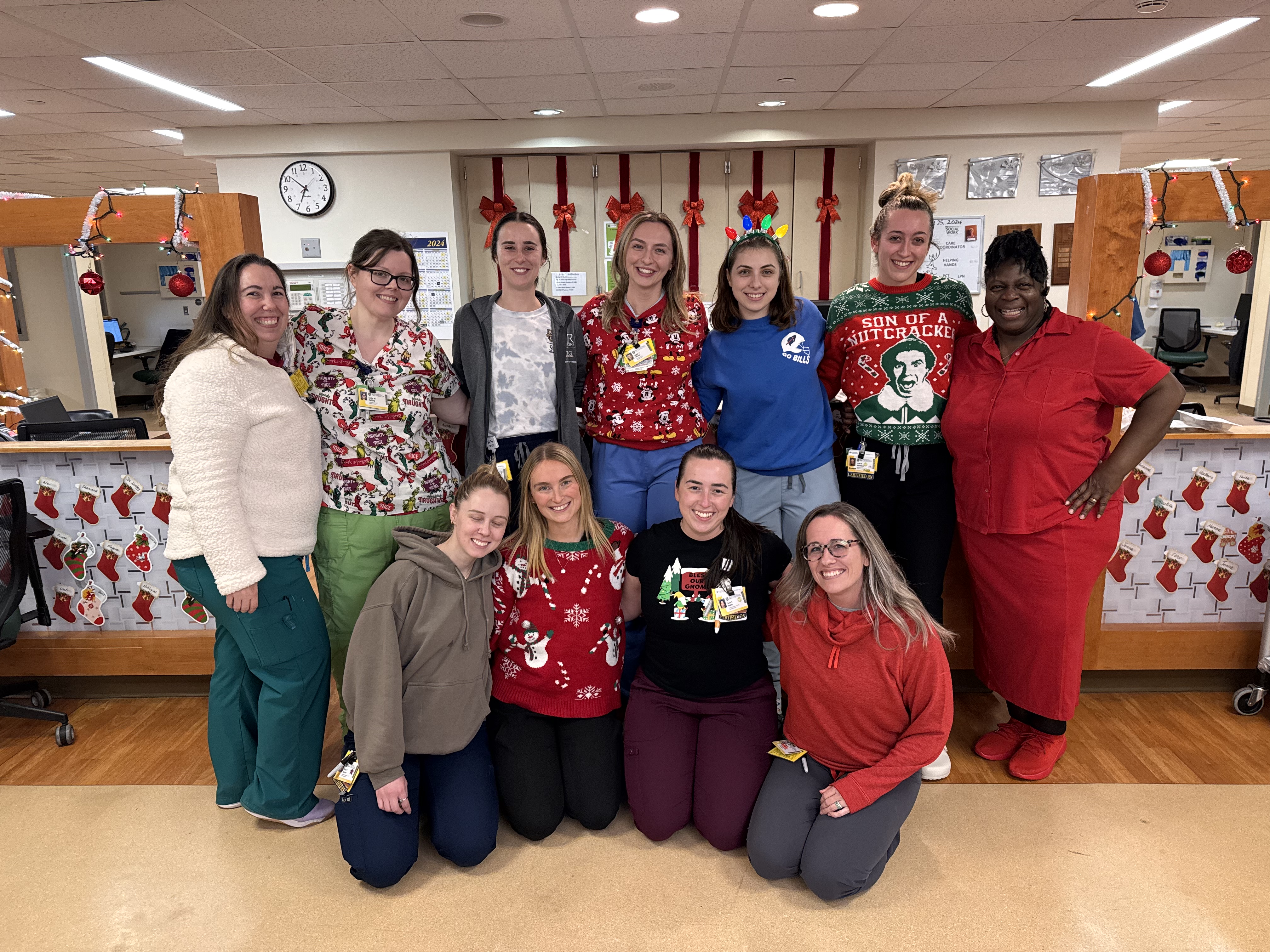 Critical care nurses wear holiday themed sweaters