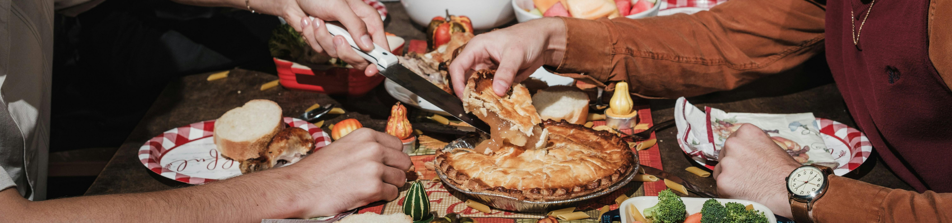 Person cutting pie to serve at the holidays