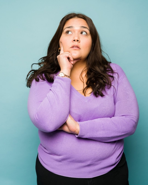 Woman eating dinner looking upset