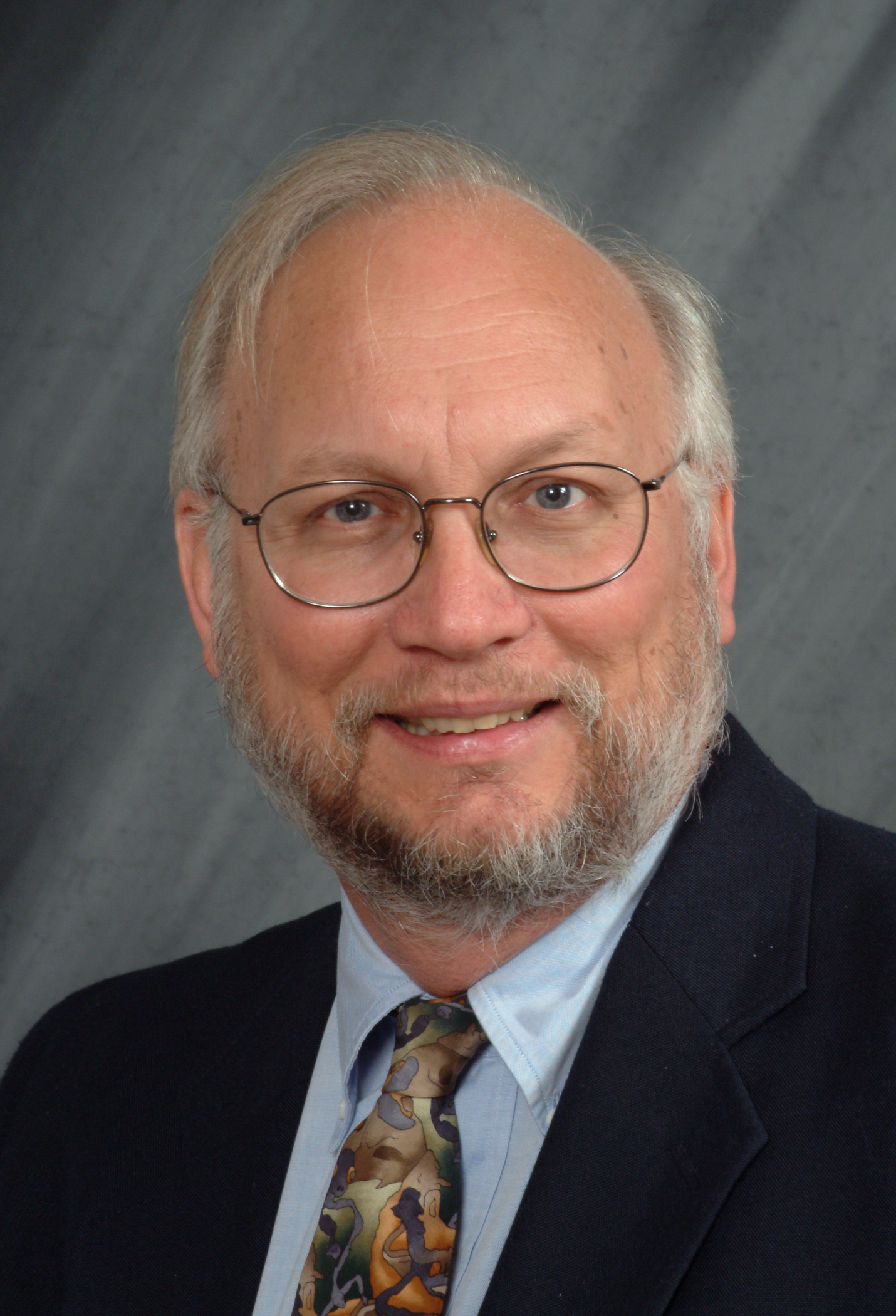 a portrait of Dr. Gene Watson.