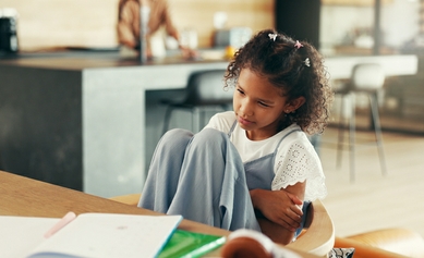 young girl feeling sick in school