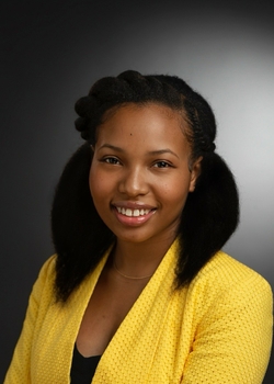 individual smiling wearing yellow blouse