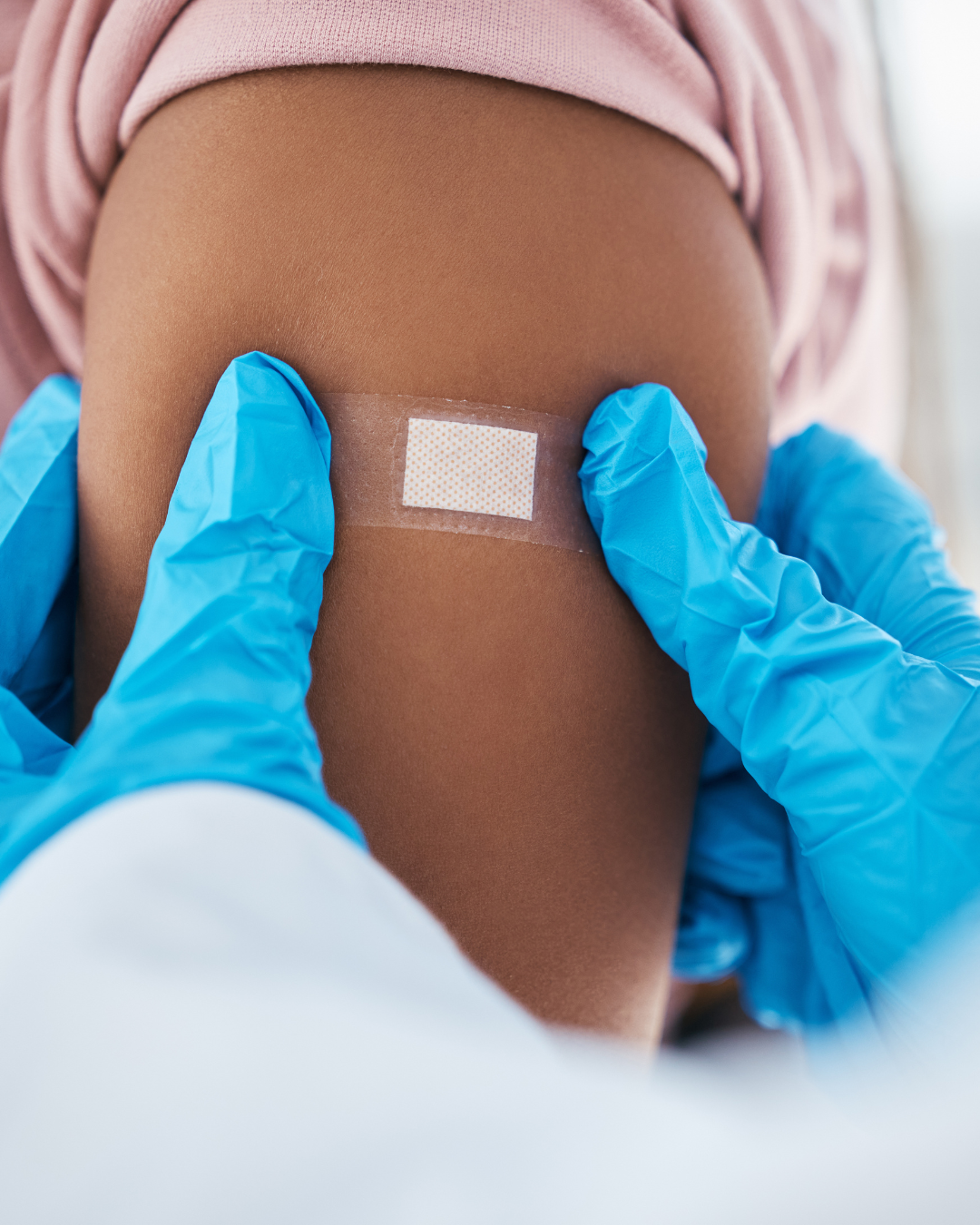 Flu vaccine bandaid on arm