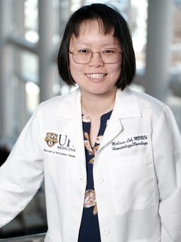 Professional portrait of Melissa Loh, MD, in a white coat