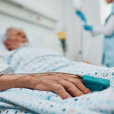 Close up of senior patient with pulse oximeter on finger in the hospital.