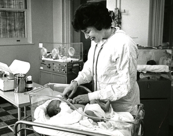 Ruth Lawrence in hospital with baby