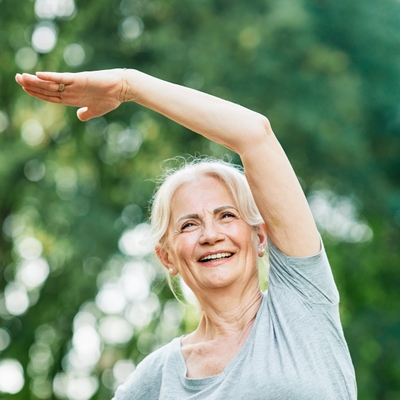 stretching for arthritis older woman arm stretch