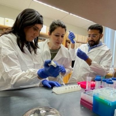 Maryam with two residents in lab