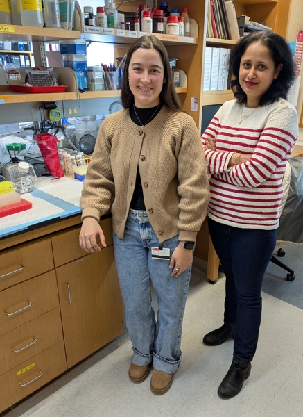 Two women standing in a science lab