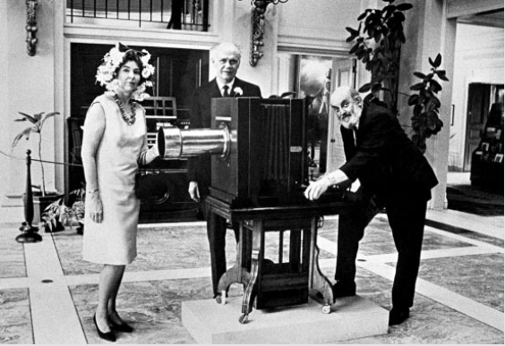 Ansel Adams, right, displays his camera at the George Eastman House with good friends Nancy and Beaumont Newhall, in 1968.