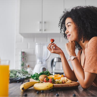 Woman eating and smiling