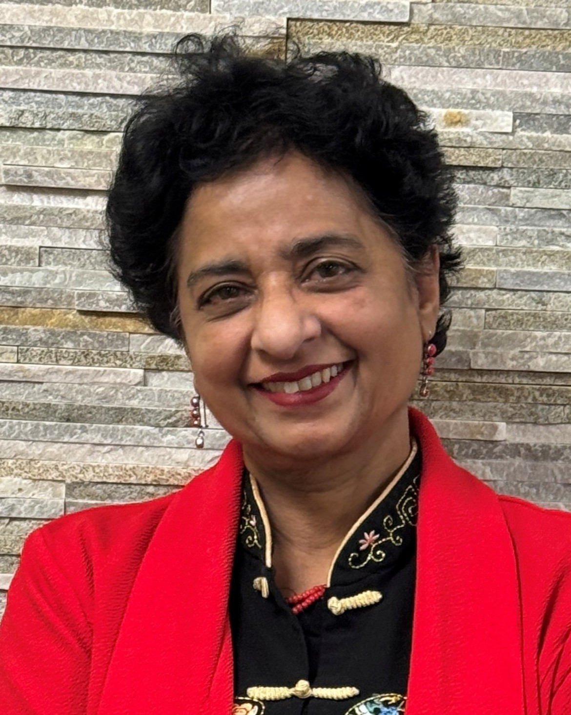 a portrait of Dr. Sangeeta Gajendra.