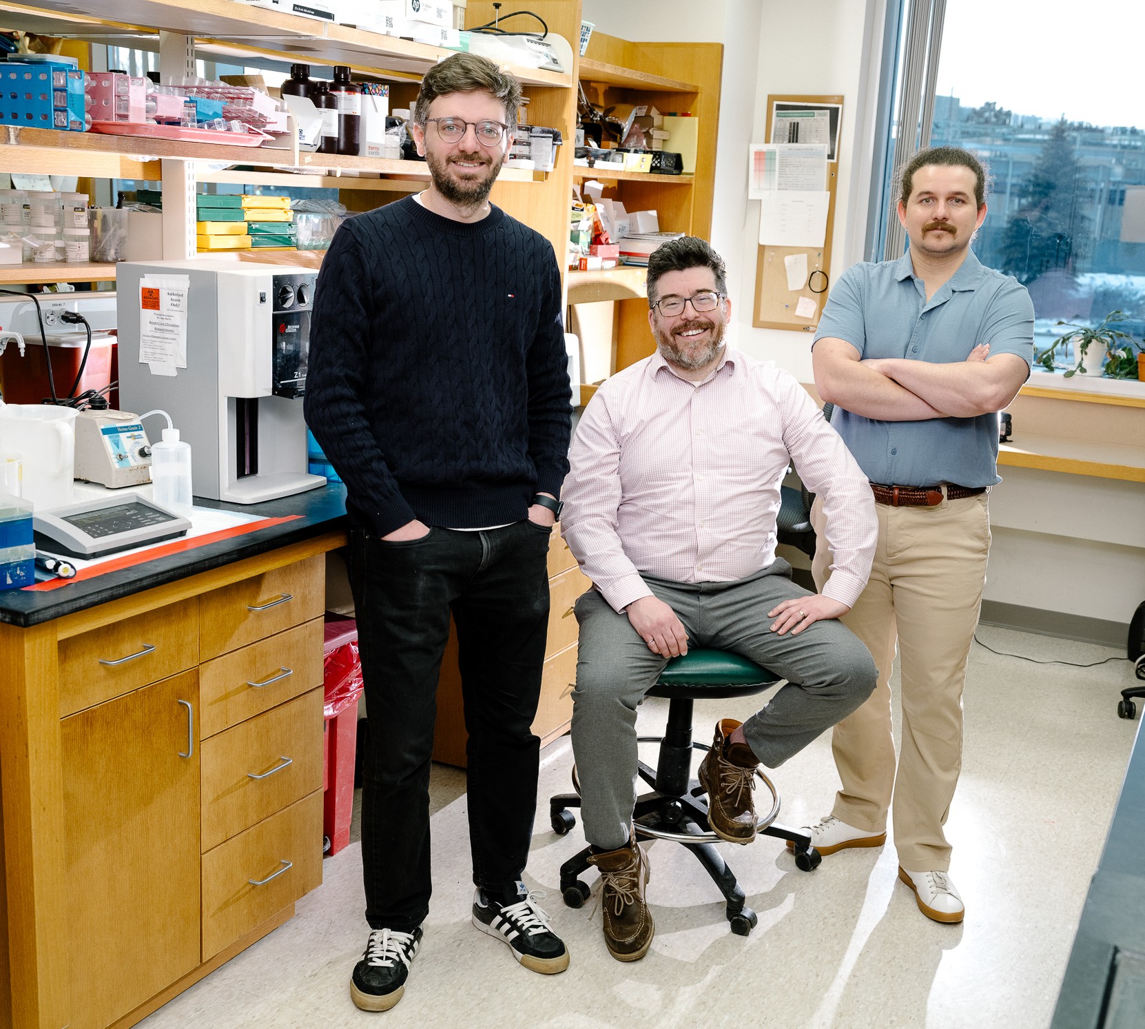 laboratory portrait of Wilmot Cancer Institute scientists Fabio Hecht, Isaac Harris, and Marco Zocchi