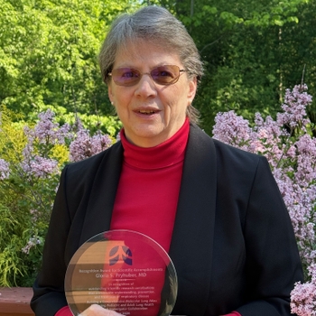 Gloria Pryhuber, MD, holds her Recognition Award for Scientific Accomplishment.
