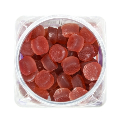 Red melatonin gummies - stock photo