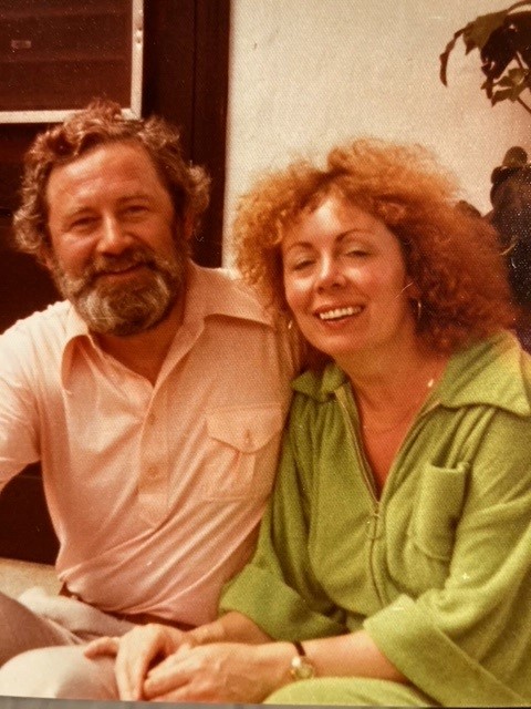 The couple in color, casually dressed smiling at camera, head and shoulder visible