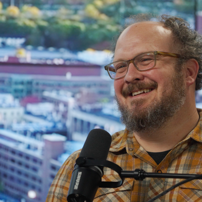 John Lueck talking into a microphone