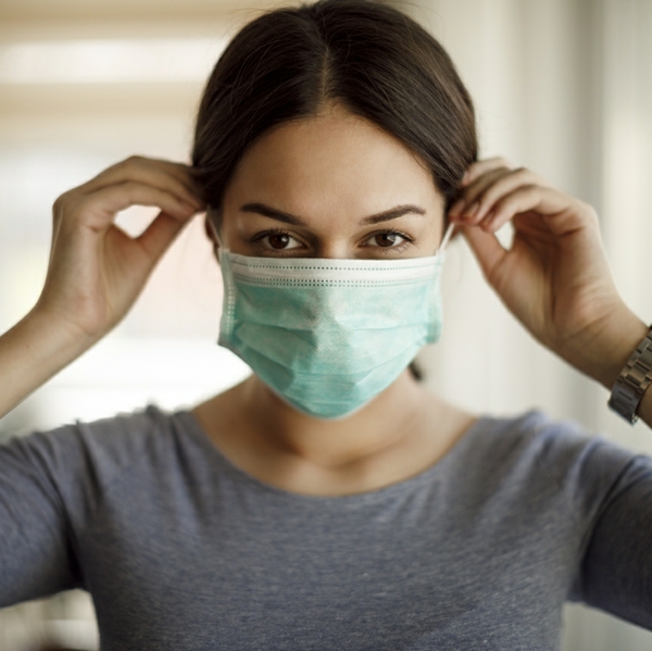 latino woman in mask