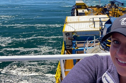 Selfie of GCI employee on fiber boat at sea