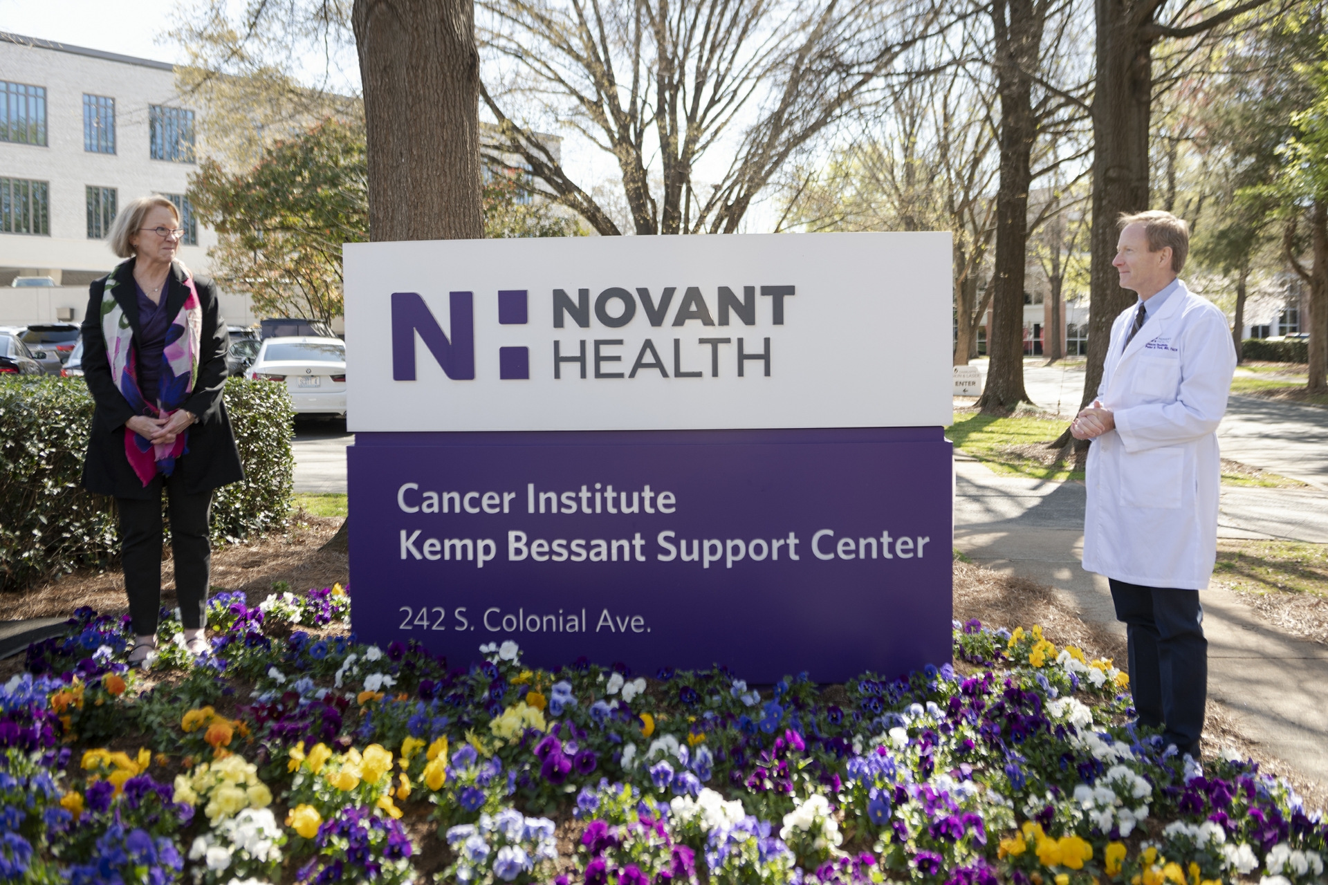 Dr. Peter Turk and Cathy Bessant with new sign for Kemp Bessant Support Center