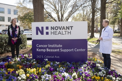 Dr. Peter Turk and Cathy Bessant with new sign