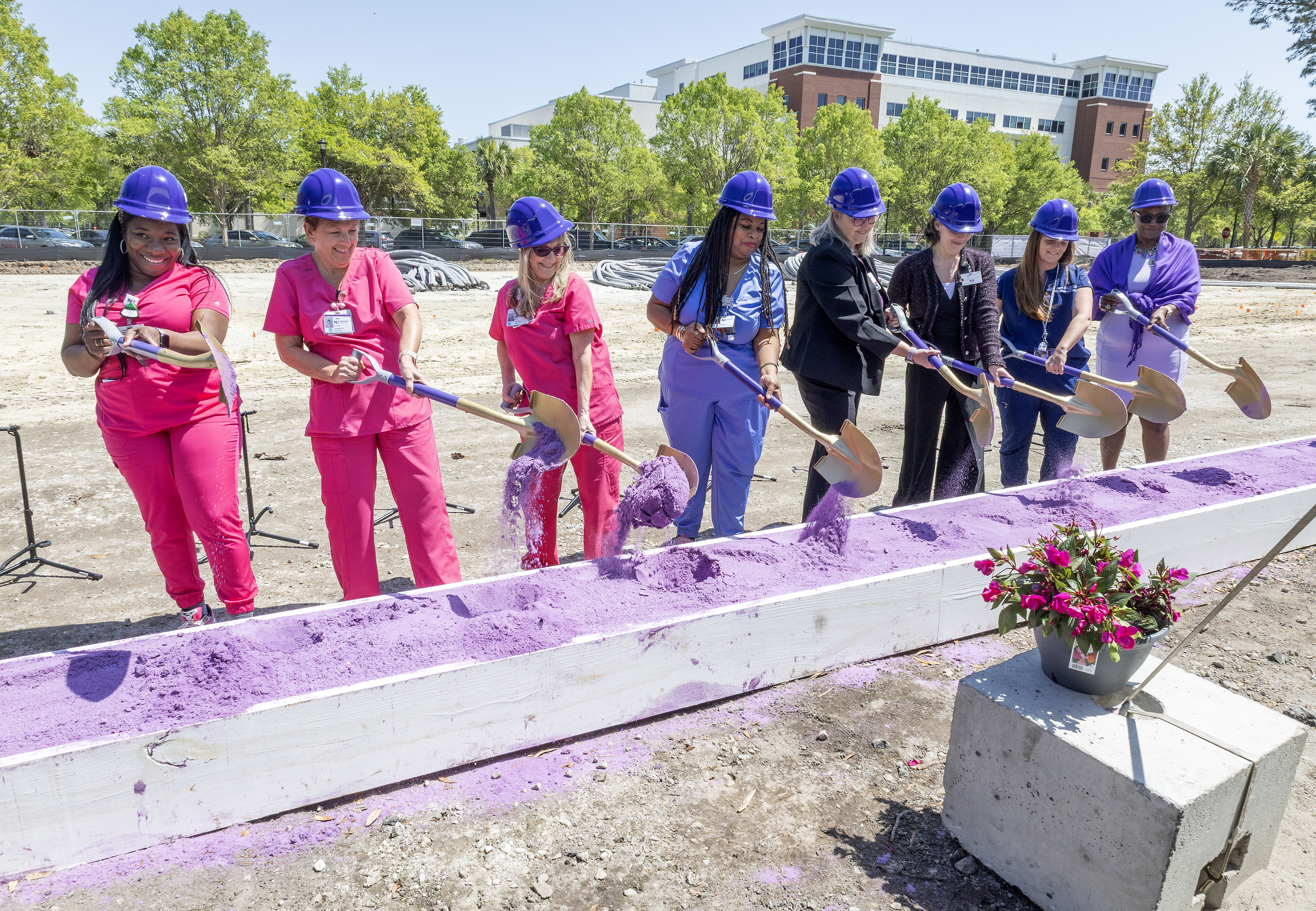 Women's Health care team members stepped up for the first turn of the aubergine sand, signifying the official groundbreaking of the new Center for Women's Health at East Cooper Medical Center in Mt. Pleasant, South Carolina. ECWomenHealth-0682