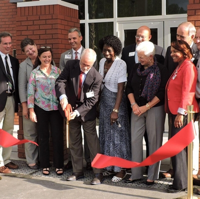 Danny Mullis cutting ribbon at Mullis Building