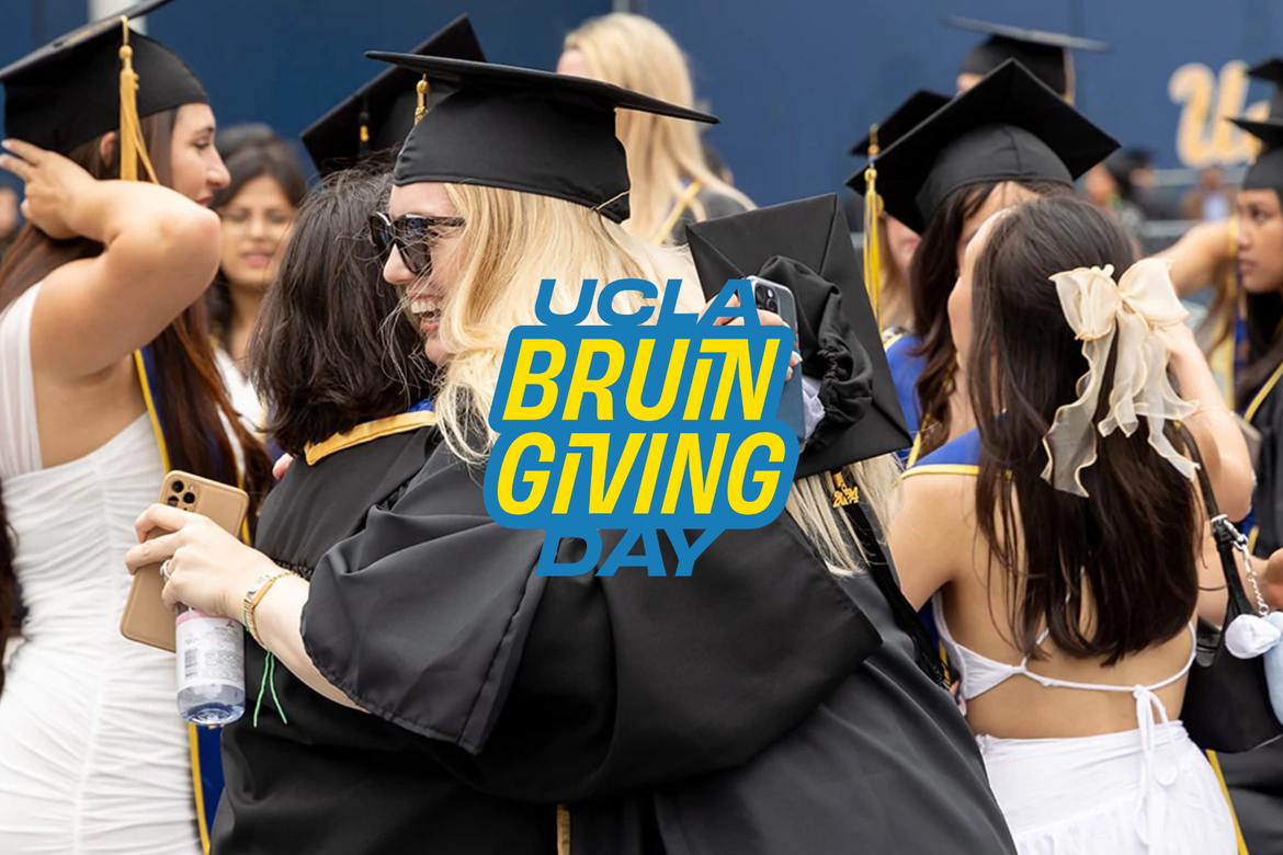 UCLA graduates hugging each other in celebration.