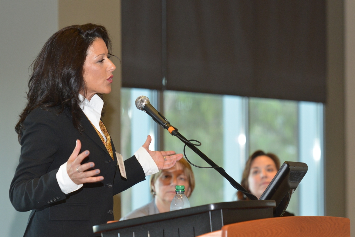 Tracey McCormack speaking at a podium
