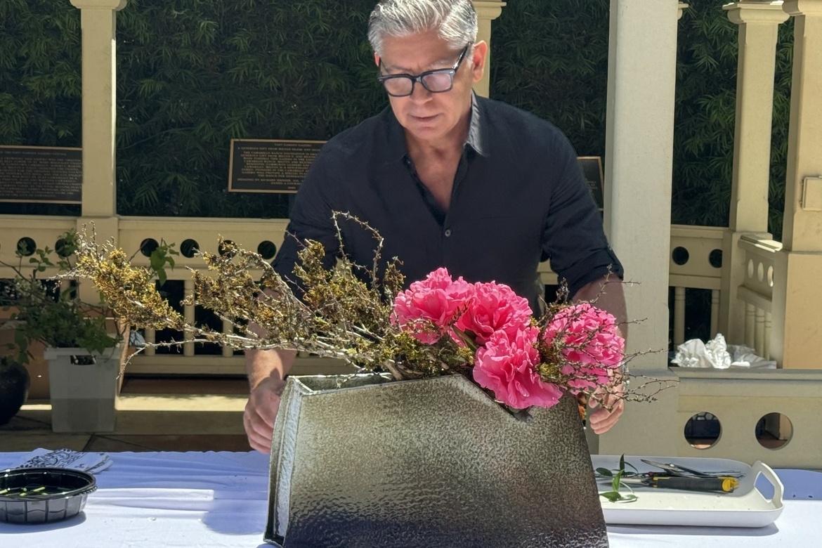 Gabriel Pacheco works on a small ikebana demonstration