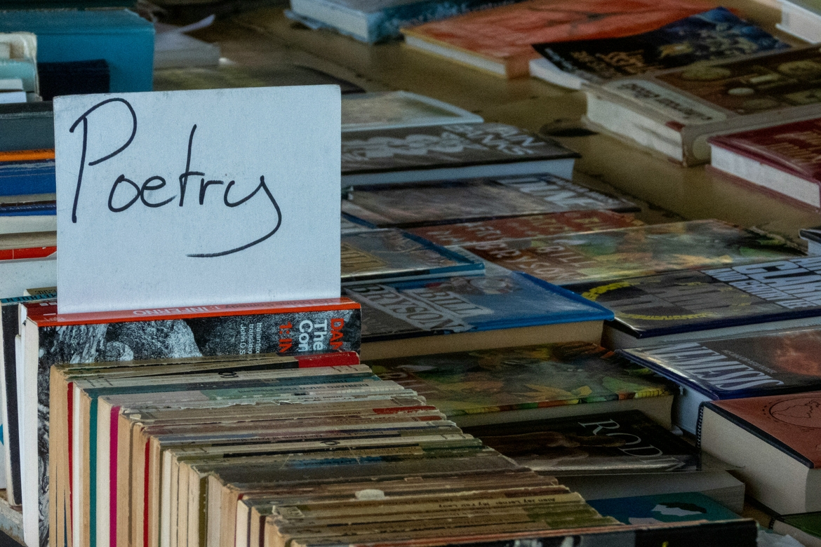 A section of poetry books in a shop