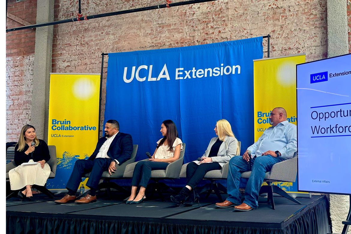 Photo | Lilian Cano moderates a panel of four on stage at the downtown ...
