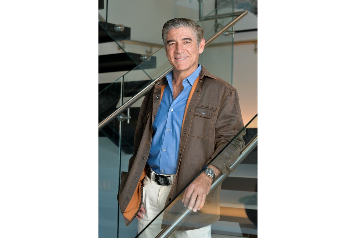 Luis de Moraes poses on a staircase