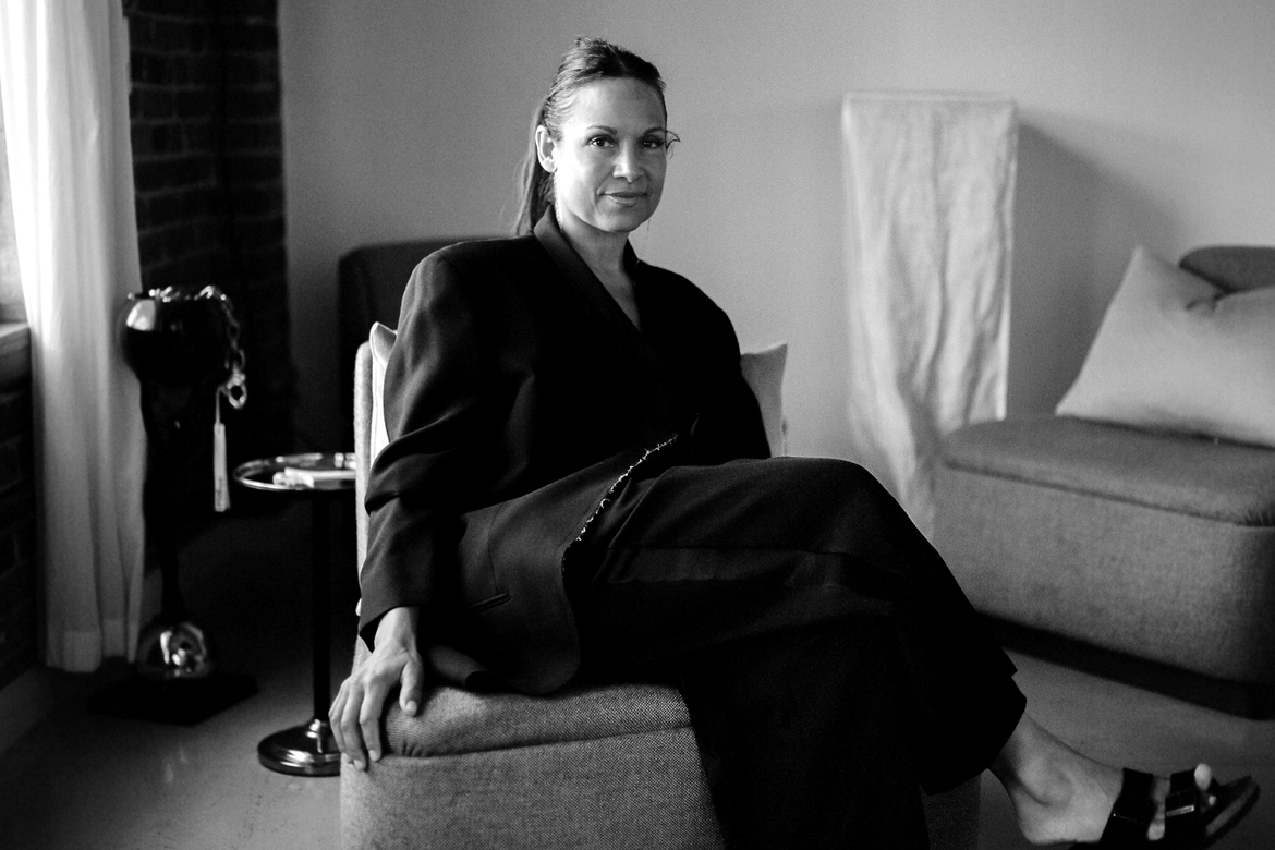 Lisa SVAN sitting in a chair in black and white