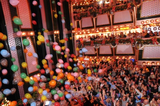 Balloons rained down on guests in the atrium at midnight.