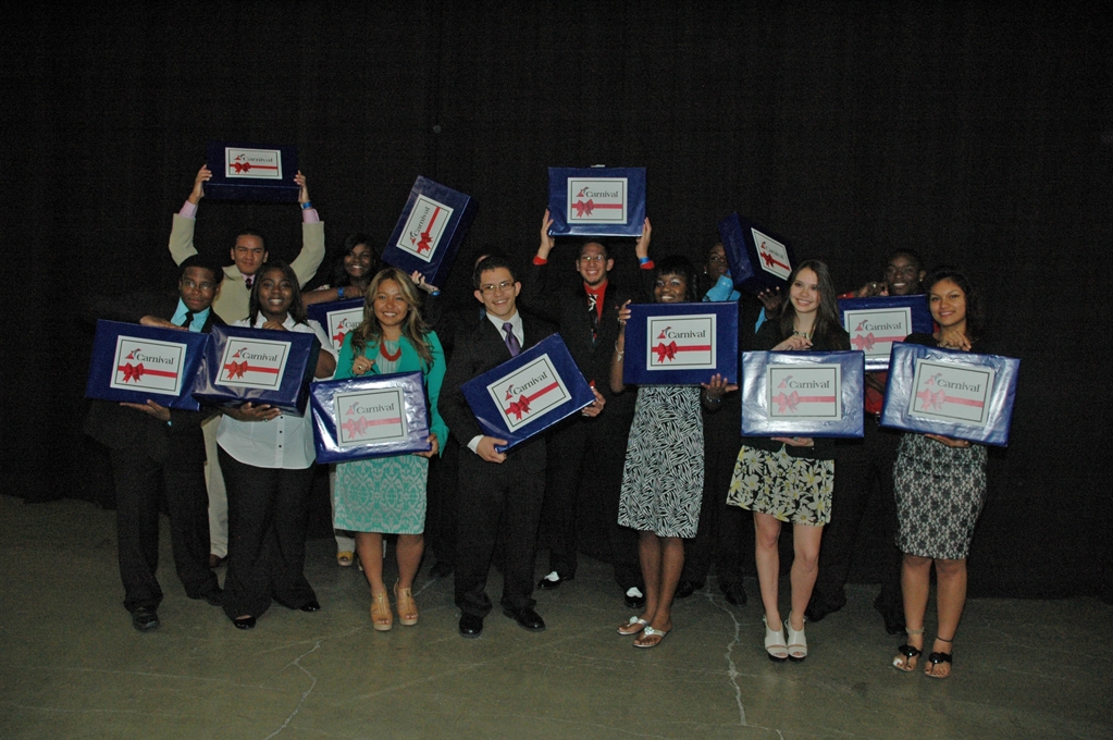 Graduates of the Carnival-sponsored HEAT Academy celebrate after the presentation. 