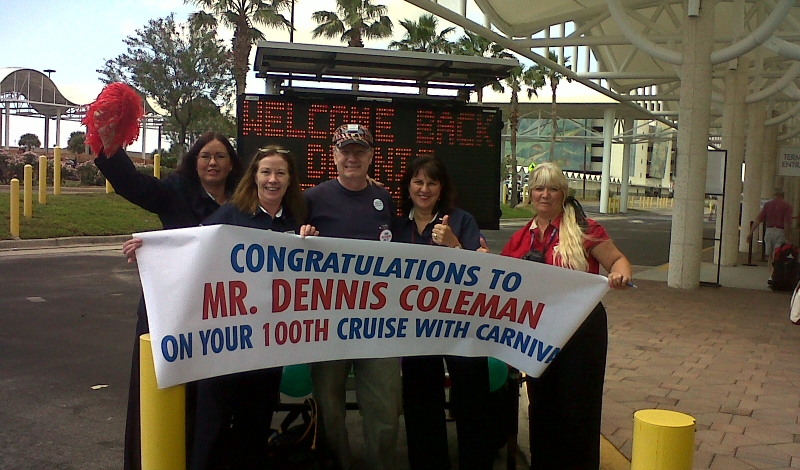Dennis Coleman is greeted by Carnival's Port Canaveral embarkation team as he gets ready to take his 100th Carnival cruise. 