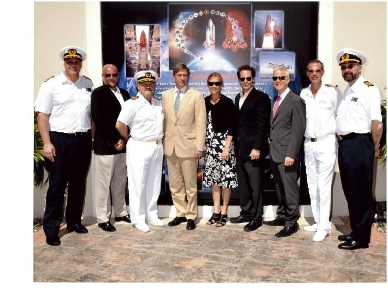 Pictured here at the unveiling of a series of murals at the Grand Turk Cruise Center as part of the island’s Space Exploration Week are (from left): Holland America Eurodam Captain Darin Bowland; Grand Turk Cruise Center General Manager John Young; Carnival MiracleCaptain Vito Giacalone; His Excellency Governor Damian (Ric) Todd; Deputy Director of Kennedy Space Center Janet Petro;  Carnival Corporation VP of Global Port & Destination Group David Candib; Art Perper of Perper Design, Inc.; Carnival Miracl