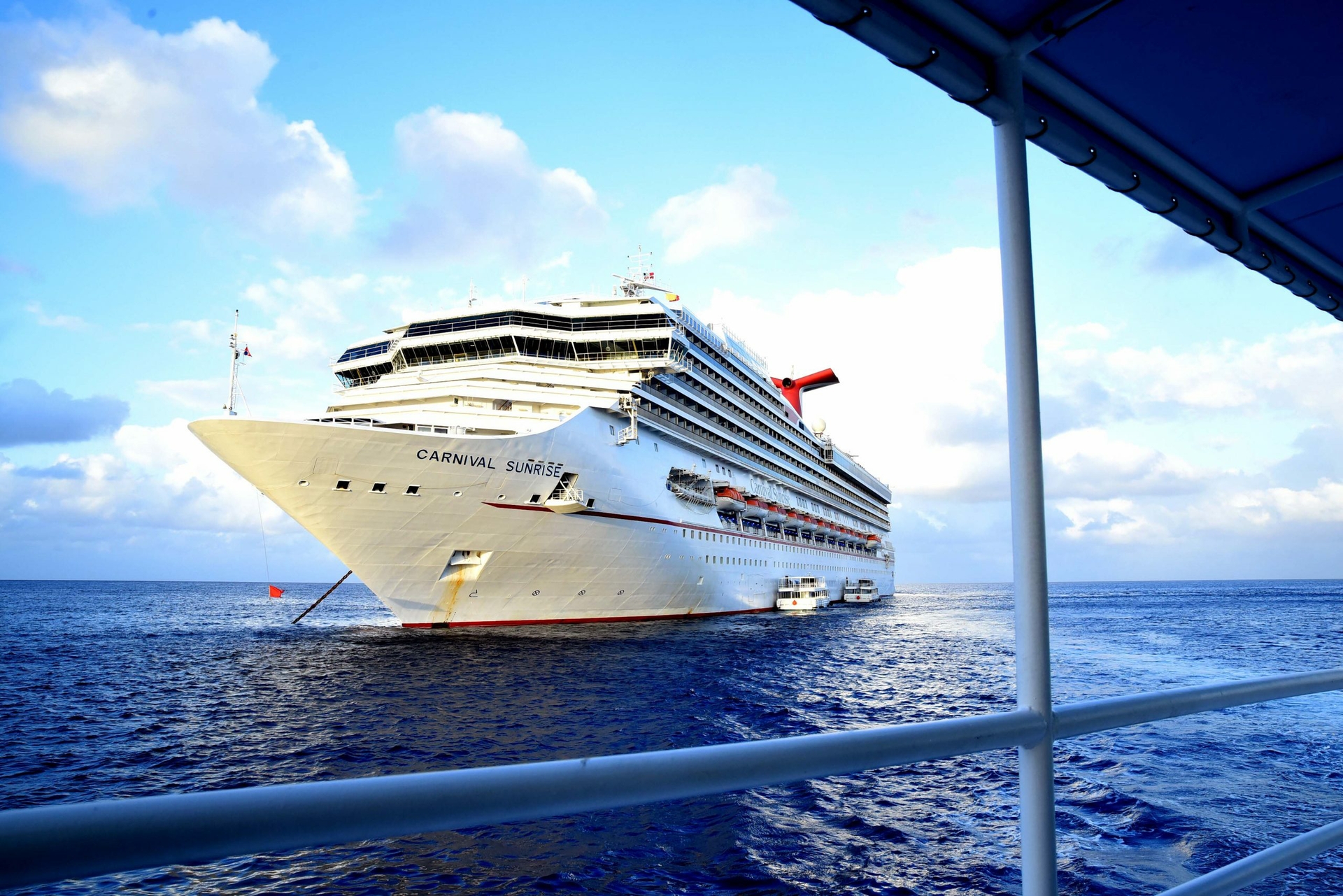 As part of Carnival Cruise Line’s successful return to guest operations, Carnival Paradise and Carnival Sunrise arrived in Grand Cayman, Cayman Islands today, marking the line’s first time back to the port since resuming service.