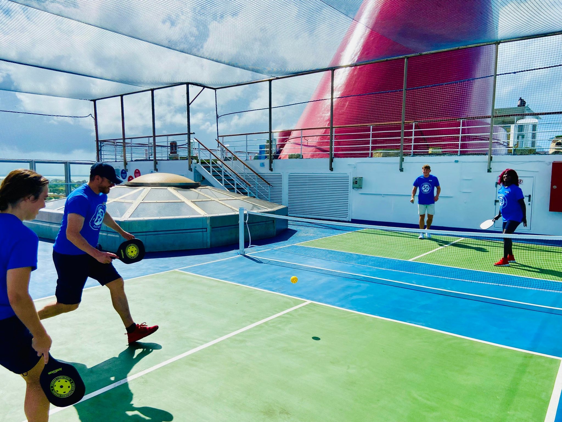 Carnival Conquest Team Plays Pickleball on Ship's New Court
